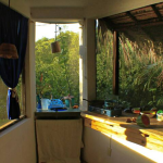 The washbasin is in the corner