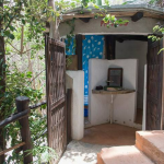 The private bathroom is outside