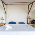 A king size bed builds the center of the bungalow